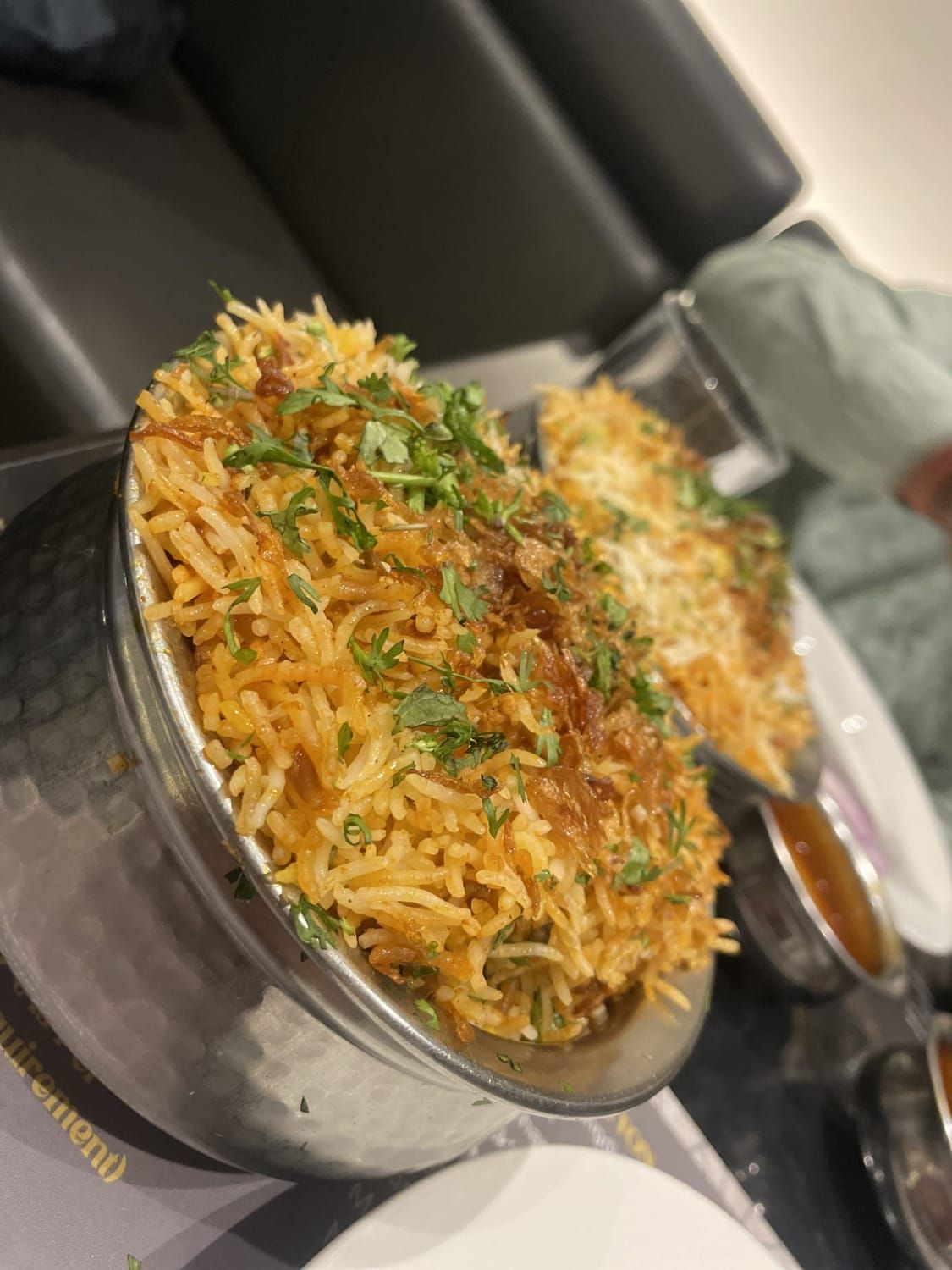 Aromatic chicken biryani garnished and ready to serve
